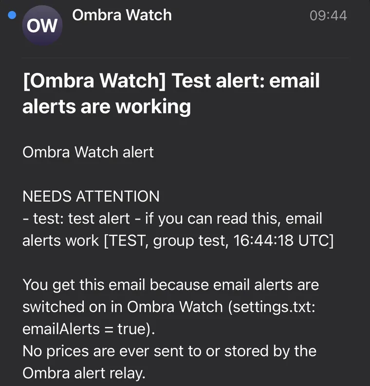 An iPhone mail screen showing an email from Ombra Watch with the subject: [Ombra Watch] Test alert: email alerts are working. The body says NEEDS ATTENTION, test alert, and that no prices are ever sent to or stored by the Ombra alert relay.